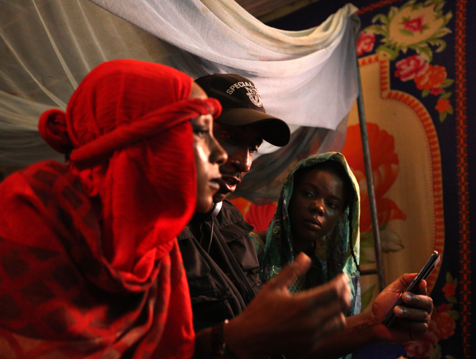 Desmond Ovbiagele with Maryam Booth and Anthonieta Kalunta, on the set of The Milkmaid in Jalingo, Taraba State, Nigeria.